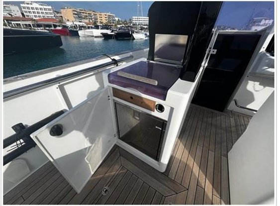 Fjord 40 Open aft deck and teak swim platform in the marina