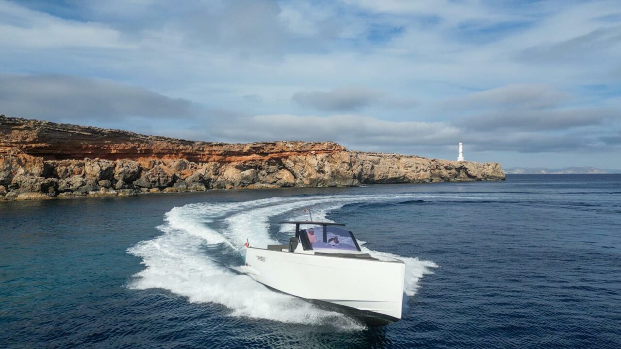 Fjord 40 Open cruising along a rocky Mediterranean coastline