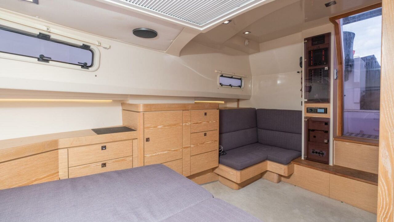 Fjord 40 Open salon interior with convertible L-shaped sofa